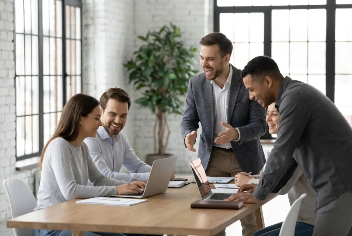Real estate team planning follow-up around a conference table